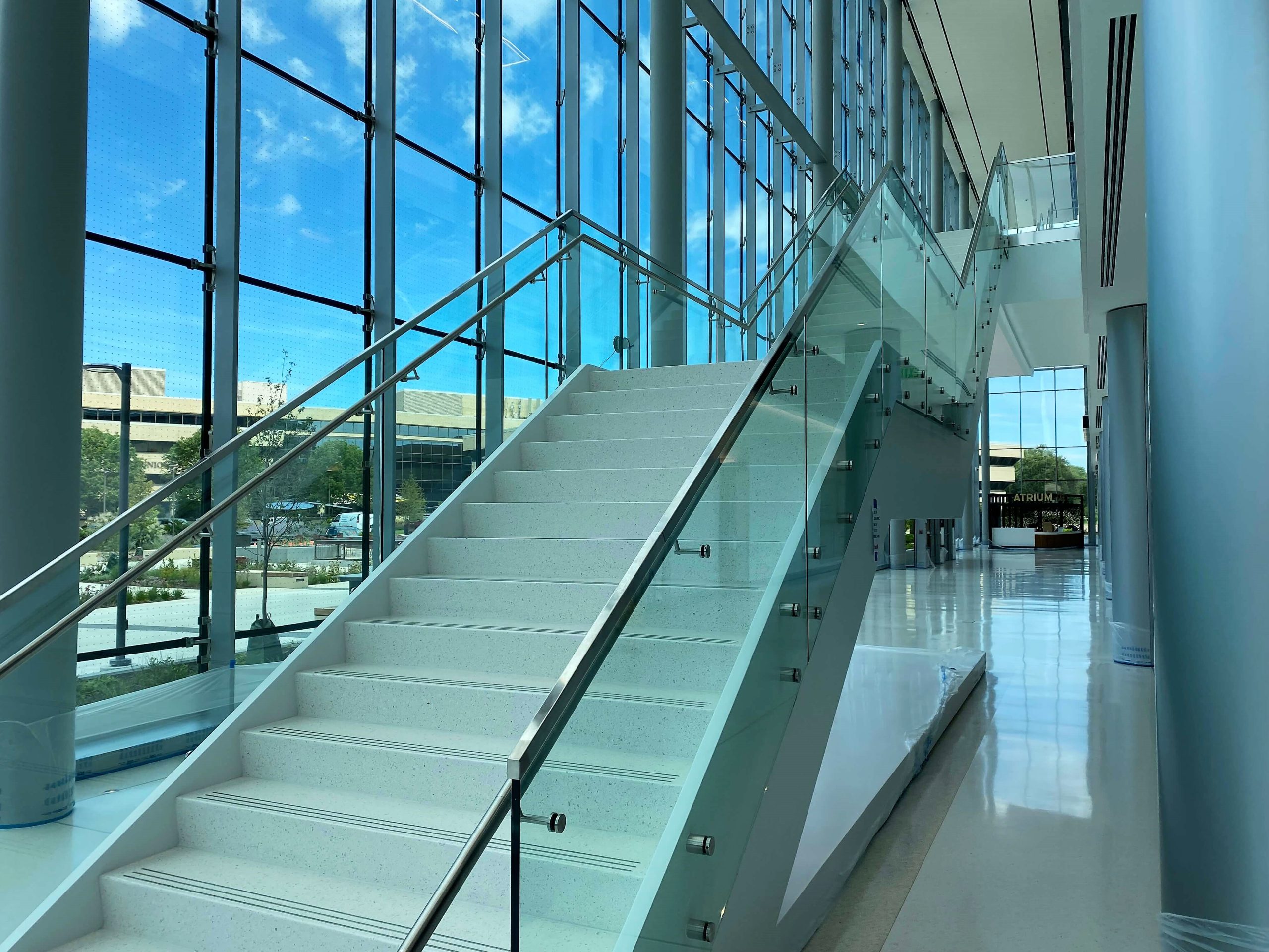 Optik™ Boss side mounted to monumental staircase